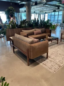 A mid brown couch on display at Neocon 2025. The Pantone color of the year is an earthy brown and is in lots of the showrooms this year. Definitely one of the trends from Neocon 2025